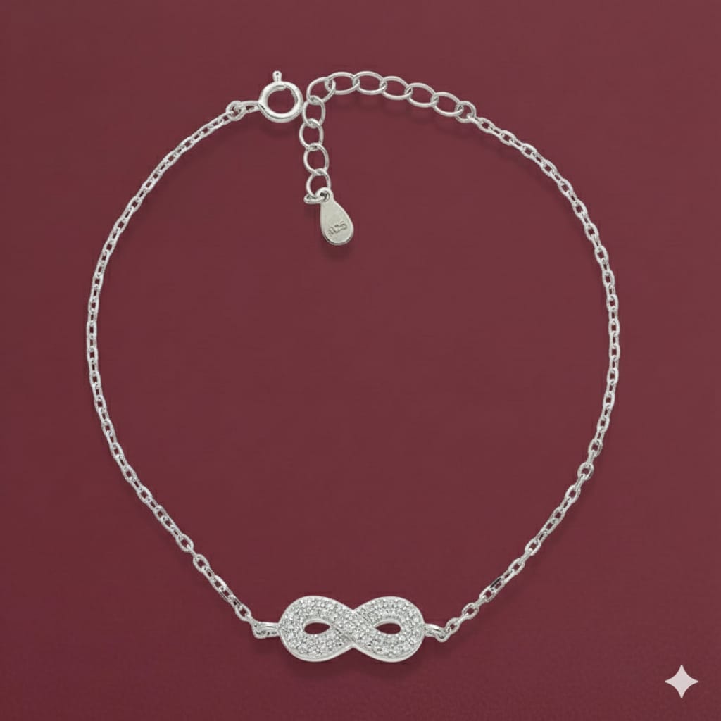Silver bracelet with an infinity symbol on a red background