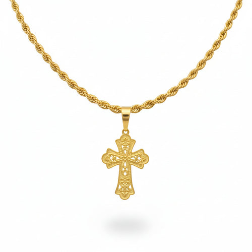 Gold necklace with a cross pendant on a black bust against a beige background